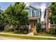 Charming two-story home features a yellow door, brick accents, a well-manicured lawn, and mature trees at 644 Granite Mill Blvd, Chapel Hill, NC 27516