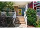 Inviting front porch with brick steps and white railings leads to a vibrant yellow front door at 644 Granite Mill Blvd, Chapel Hill, NC 27516
