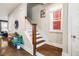 Inviting hallway with hardwood stairs, natural light, and stylish decor at 644 Granite Mill Blvd, Chapel Hill, NC 27516