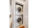 Modern white stackable washer and dryer inside a closet for space saving convenience at 644 Granite Mill Blvd, Chapel Hill, NC 27516