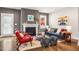 Cozy living room with a fireplace, hardwood floors, and stylish furnishings at 644 Granite Mill Blvd, Chapel Hill, NC 27516