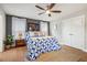Comfortable bedroom featuring a ceiling fan, warm carpet, and abundant natural light at 644 Granite Mill Blvd, Chapel Hill, NC 27516