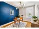 Modern office offers a stylish light fixture, calm colors, and abundant natural light at 644 Granite Mill Blvd, Chapel Hill, NC 27516
