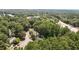 Overhead shot of the community offering a lush, tree-filled setting and nearby streets at 7159 Sandy Creek Dr, Raleigh, NC 27615