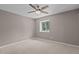 Bedroom featuring neutral walls, carpet and a window at 7159 Sandy Creek Dr, Raleigh, NC 27615