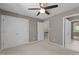 Bedroom with carpet, a ceiling fan, and closet at 7159 Sandy Creek Dr, Raleigh, NC 27615