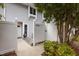 Charming townhome exterior with white privacy fence and cozy entry area at 7159 Sandy Creek Dr, Raleigh, NC 27615