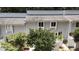 Exterior view of a well-maintained townhome with mature trees at 7159 Sandy Creek Dr, Raleigh, NC 27615