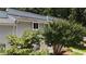 Upper exterior view of a townhouse complex surrounded by lush trees at 7159 Sandy Creek Dr, Raleigh, NC 27615