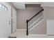 Inviting foyer with tiled floors, staircase, and natural light at 7159 Sandy Creek Dr, Raleigh, NC 27615