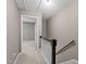 Upstairs hallway featuring neutral paint with a white ceiling and carpet flooring at 7159 Sandy Creek Dr, Raleigh, NC 27615