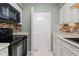 Convenient laundry room adjacent to kitchen, equipped with modern appliances and extra storage space at 7159 Sandy Creek Dr, Raleigh, NC 27615