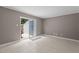 Comfortable living room featuring a sliding door to the backyard and tiled floors at 7159 Sandy Creek Dr, Raleigh, NC 27615