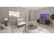 Cozy living room with chic decor, including artwork and entertainment unit, creating a stylish and inviting atmosphere at 7159 Sandy Creek Dr, Raleigh, NC 27615