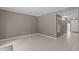 Inviting living room with neutral walls and floors that lead to the front door and hallway at 7159 Sandy Creek Dr, Raleigh, NC 27615