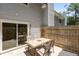 View of a patio with a table and chairs, with access to the home at 7159 Sandy Creek Dr, Raleigh, NC 27615