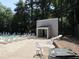 Community pool featuring ample seating and a nearby bathhouse at 7159 Sandy Creek Dr, Raleigh, NC 27615