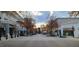 Shopping center street view with boutiques, restaurants, and holiday decorations for a festive atmosphere at 7159 Sandy Creek Dr, Raleigh, NC 27615