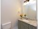 Charming bathroom featuring a granite countertop vanity, modern fixtures, and neutral tones, creating a serene and stylish space at 723 Lindley Dr, Durham, NC 27703