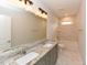 Elegant bathroom with double sink vanity, granite countertops, and a soaking tub, perfect for relaxation and pampering at 723 Lindley Dr, Durham, NC 27703