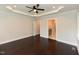 Spacious bedroom boasts hardwood floors, neutral walls, and a view into the ensuite bathroom at 723 Lindley Dr, Durham, NC 27703
