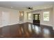 Bright living room boasts beautiful hardwood floors, multiple windows, and neutral color palette at 723 Lindley Dr, Durham, NC 27703
