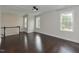 Bright loft area with hardwood floors, staircase access, and natural light, creating a versatile space for relaxation or work at 723 Lindley Dr, Durham, NC 27703