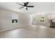 Open living room boasts new flooring, updated lighting, and leads to a modern kitchen at 768 Lunar Dr, Raleigh, NC 27610