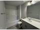 Bright bathroom with a tub and shower combo, plus a gray vanity at 805 Portland Rose Dr, Knightdale, NC 27545