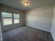 Bedroom with carpet and two windows, with views to the exterior at 805 Portland Rose Dr, Knightdale, NC 27545