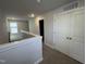 Upstairs hallway featuring neutral carpet, white doors and trim, and natural light at 805 Portland Rose Dr, Knightdale, NC 27545
