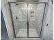 Stylish shower featuring a glass enclosure and a marble tile design at 805 Portland Rose Dr, Knightdale, NC 27545