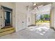 Clean, bright garage featuring neutral paint, concrete floors, and traditional double doors to the interior at 805 Tower St, Raleigh, NC 27607