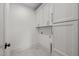 Neat laundry room featuring modern cabinets, grey tile floors, and a convenient layout at 805 Tower St, Raleigh, NC 27607