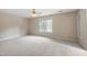 Bedroom featuring neutral walls, plush carpeting, ceiling fan, and a window with view at 809 Green Passage Ln, Apex, NC 27502