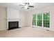 Bright bedroom with fireplace, large window and neutral carpet at 809 Green Passage Ln, Apex, NC 27502