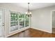 Cozy dining area with large window and views of outdoor deck at 809 Green Passage Ln, Apex, NC 27502