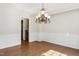 Spacious dining room with hardwood floors and decorative chandelier at 809 Green Passage Ln, Apex, NC 27502