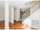 Welcoming foyer with wood floors and staircase at 809 Green Passage Ln, Apex, NC 27502