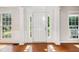 Bright foyer with wood floors, flanked by windows and decorative molding at 809 Green Passage Ln, Apex, NC 27502
