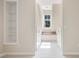 Hallway with window seat and built in shelving and natural light at 809 Green Passage Ln, Apex, NC 27502