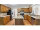 Well-equipped kitchen with island, granite countertops, and stainless steel appliances at 809 Green Passage Ln, Apex, NC 27502