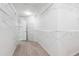 Walk-in closet with white wire shelving for optimal storage and organization of personal items at 809 Green Passage Ln, Apex, NC 27502