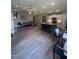 Bright, open-concept kitchen and living area with stainless steel appliances and a granite island at 820 Christian Light Rd, Fuquay Varina, NC 27526