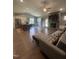 Open-concept living space boasting a stone fireplace, hardwood floors, and seamless flow to the kitchen at 820 Christian Light Rd, Fuquay Varina, NC 27526