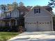 Charming two-story home with stone accents and a two-car garage at 8228 Clarks Branch Dr, Raleigh, NC 27613