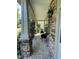 Relaxing front porch with stone columns and a brick floor at 8228 Clarks Branch Dr, Raleigh, NC 27613
