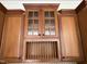 Kitchen cabinets with glass doors and rope trim detailing offer plentiful storage at 8228 Clarks Branch Dr, Raleigh, NC 27613