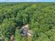 Gorgeous home nestled among mature trees, offering privacy and a serene natural setting at 8510 Dunlee Falls Rd, Raleigh, NC 27613