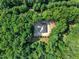 Breathtaking aerial view showcases lush greenery, mature trees and a peaceful setting for the home at 8510 Dunlee Falls Rd, Raleigh, NC 27613